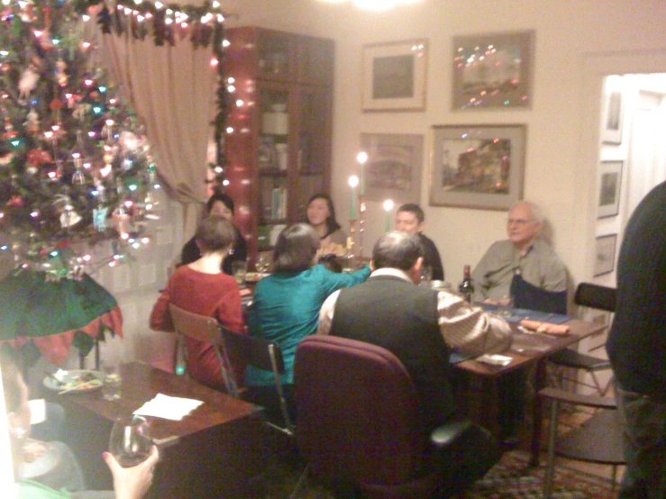 a group of people are gathered in a large room