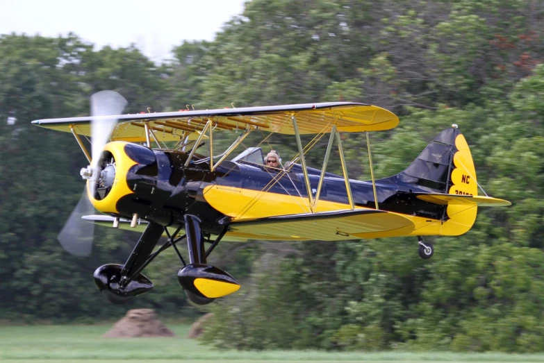 a small airplane is flying through the air