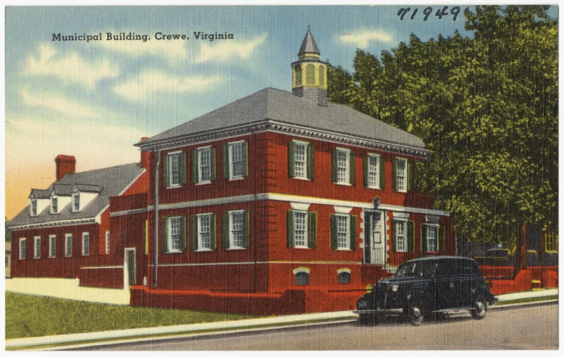 a red building with a steeple next to a street