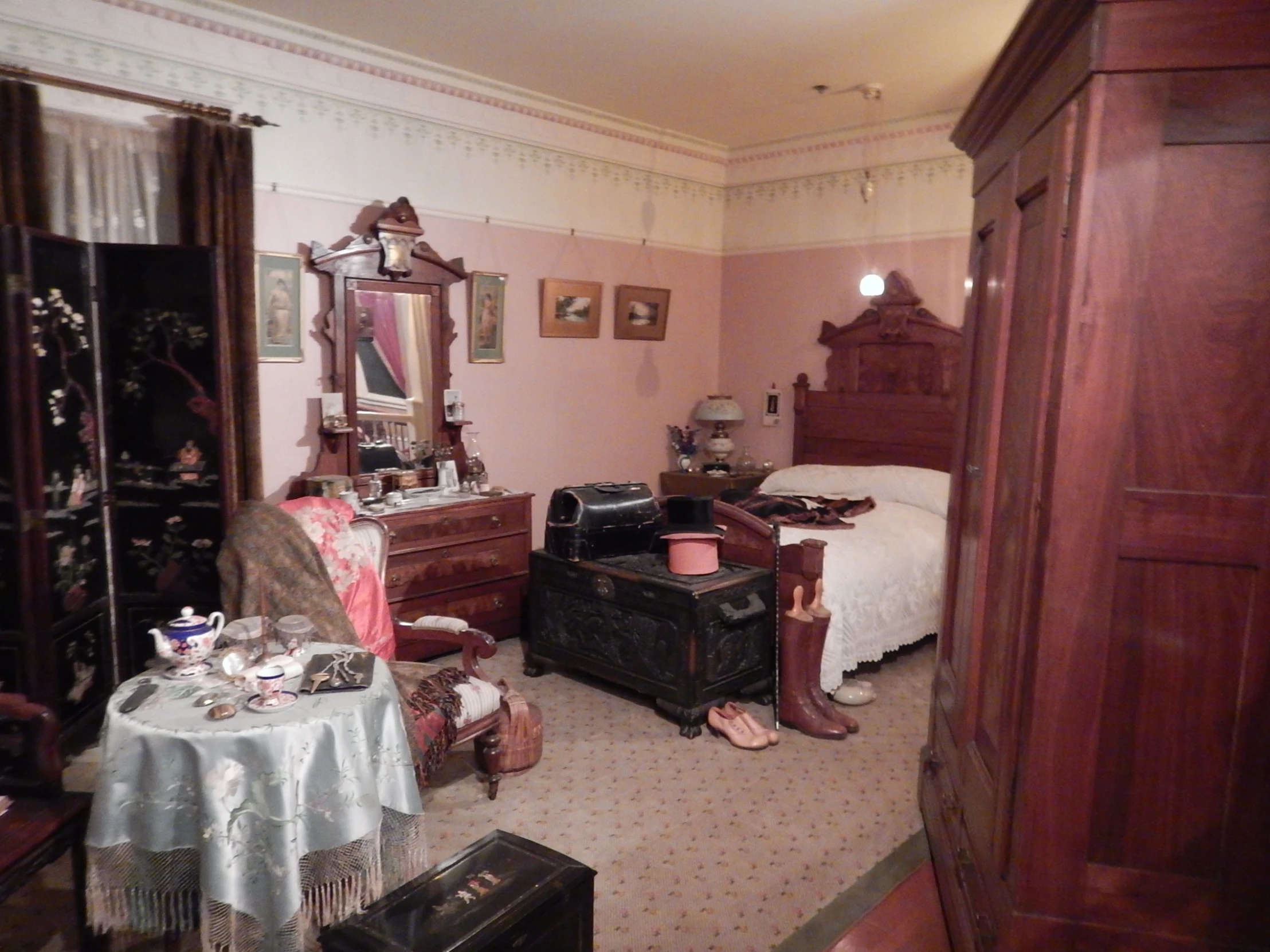 this is a bedroom in a small victorian home