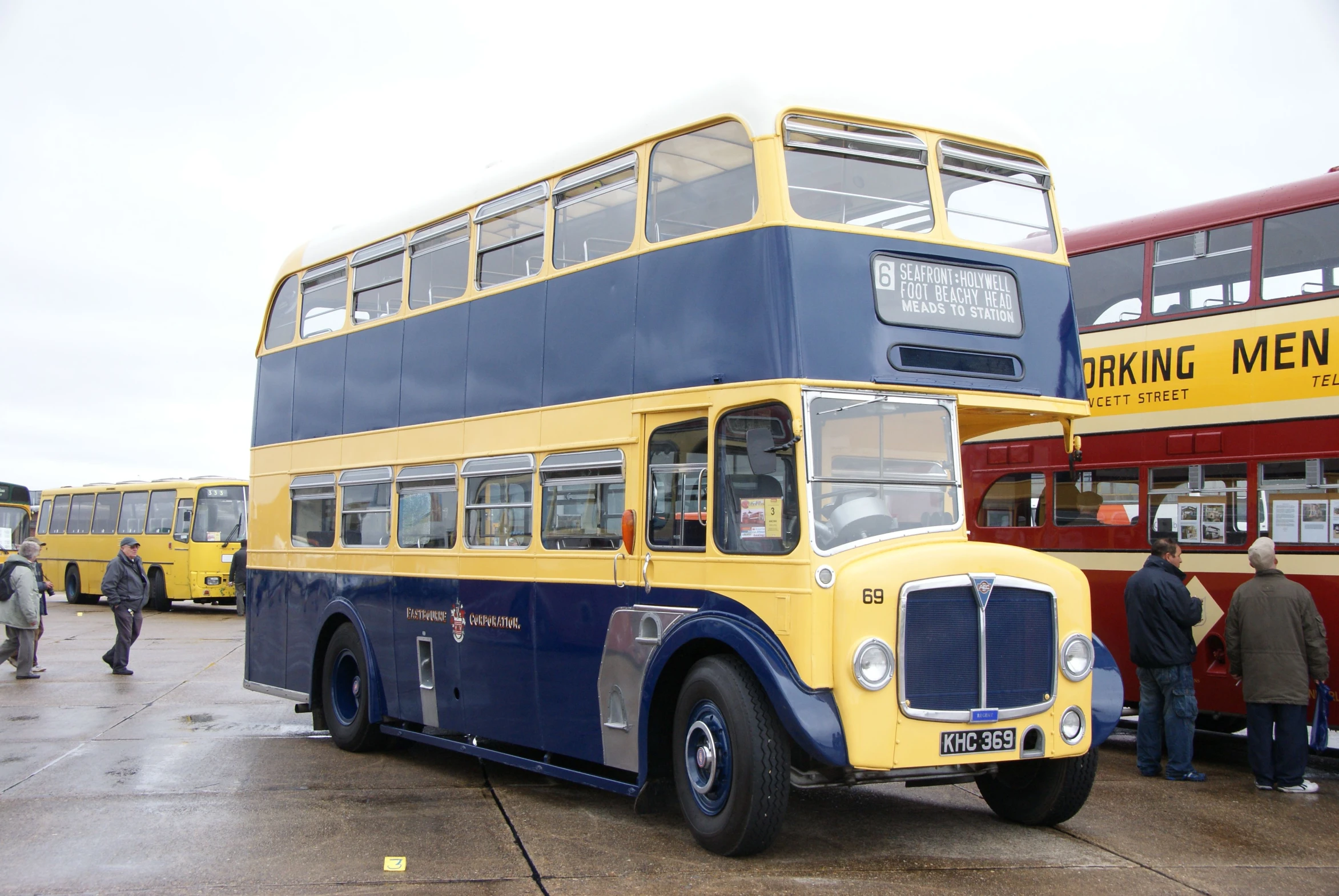 a couple of double decker buses parked near one another