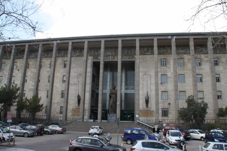 a huge stone building with columns on the front and side