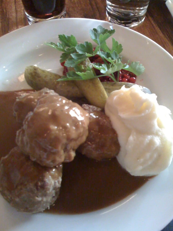 a plate of food with a fork and spoon on it