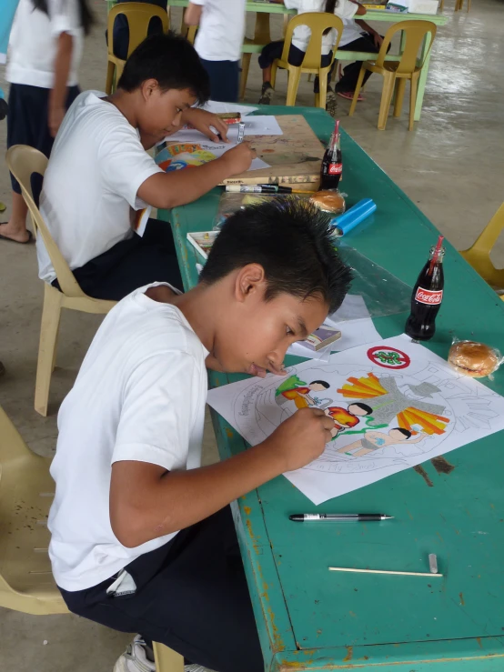 an image of two boys doing some crafts