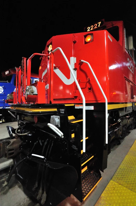 a train is parked on the side of the tracks