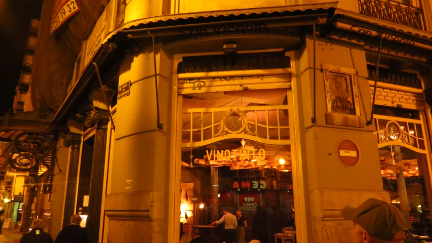 a store front on the corner at night