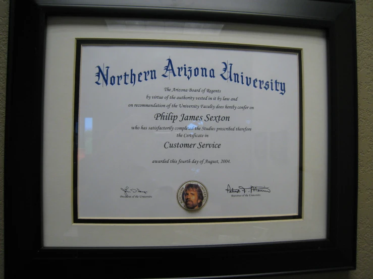 the framed diploma was presented in a dark frame