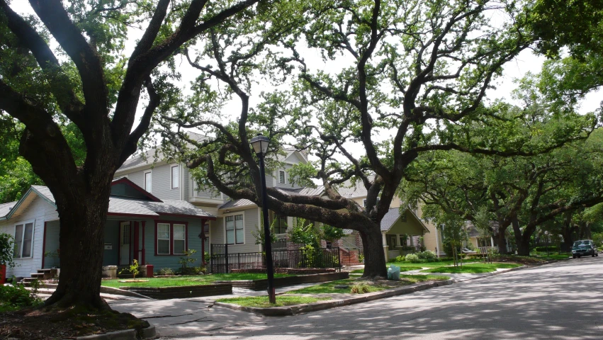 an intersection in the middle of several small homes