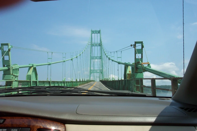 the view from a car looking over a bridge