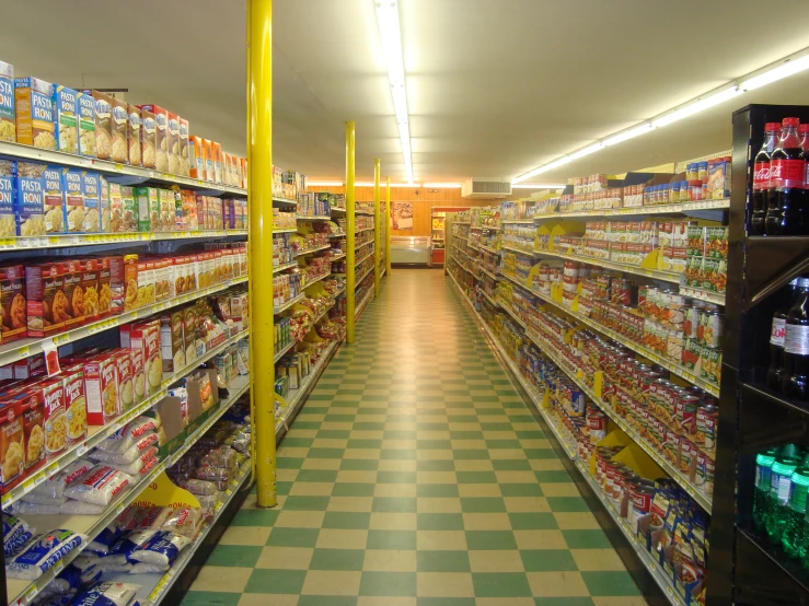 a row of grocery shelves in a grocery store