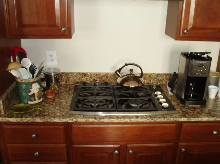 a stove that is surrounded by many kitchen accessories