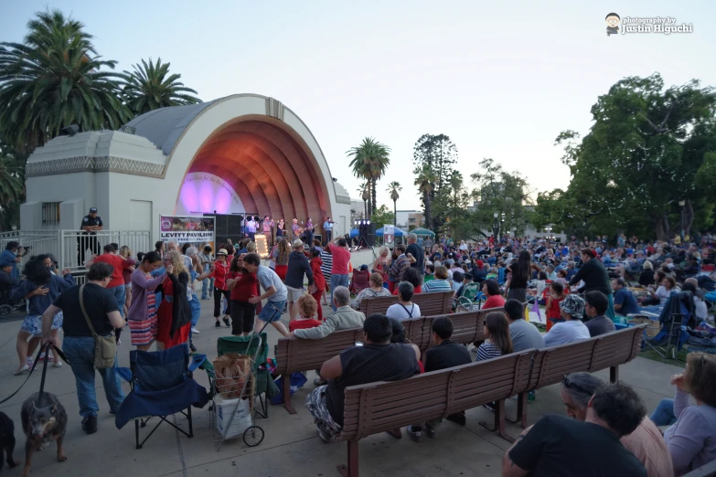 a large group of people gathered together at a concert