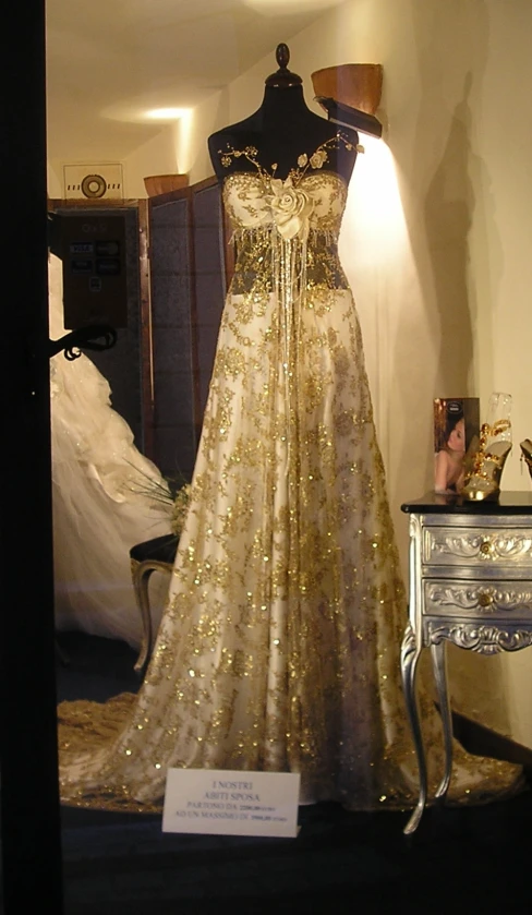 a wedding dress is on display in a room