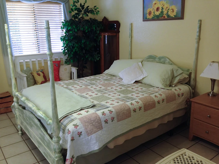 a bed in a room with a wooden headboard and foot board