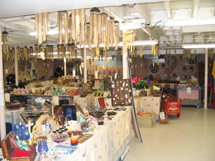 a market area with various displays of items for sale