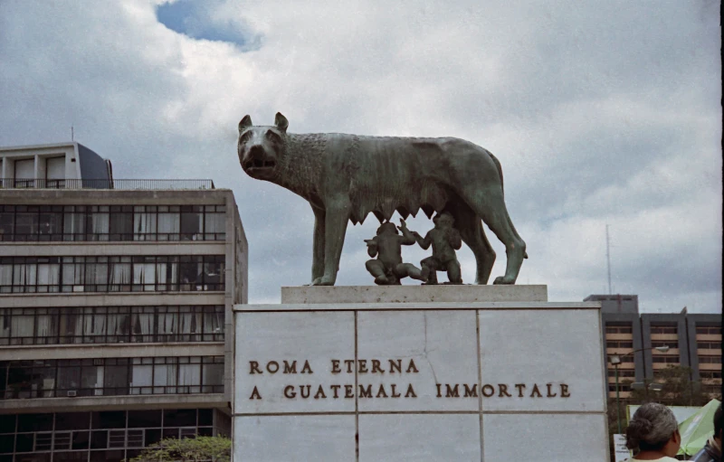 a statue of an animal with its young calves