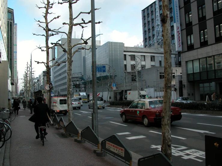 a woman is riding a bicycle in the city