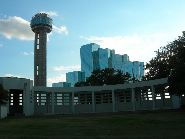 a tall tower in the middle of buildings