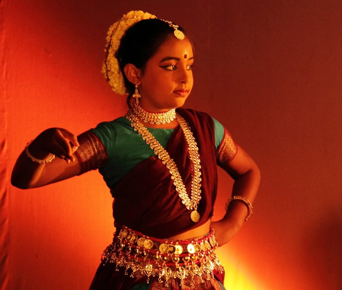 woman performing a dance pose with other hand