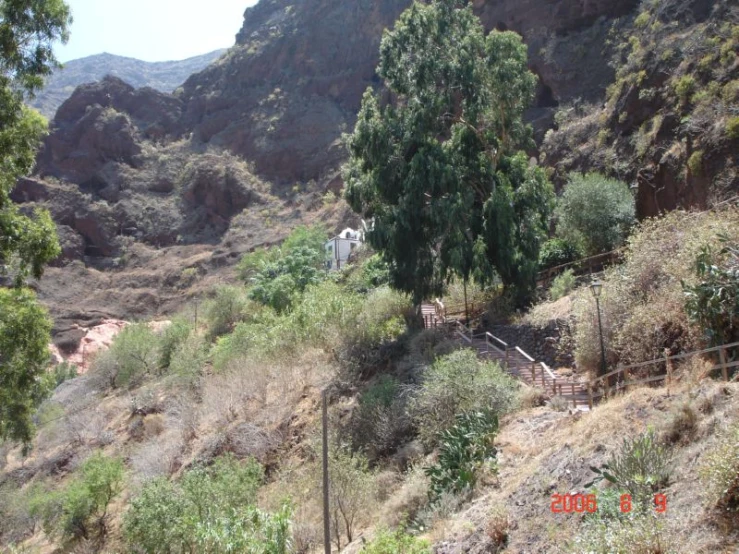 the trail follows the mountainside, leaving the walkers to the right