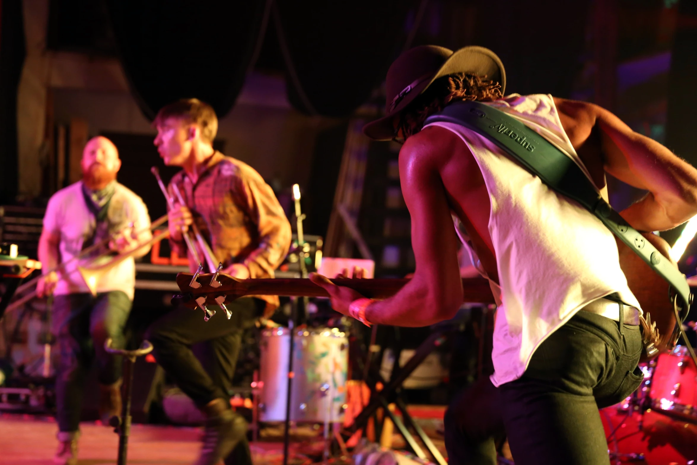 a group of men playing musical instruments on stage