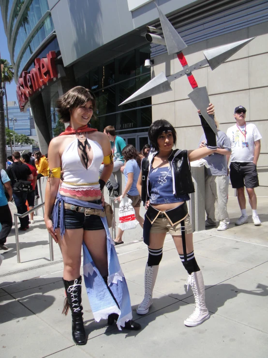 two people dressed up as characters standing on the street