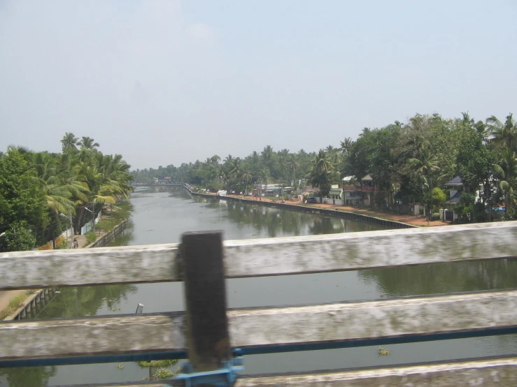 a body of water with houses next to it