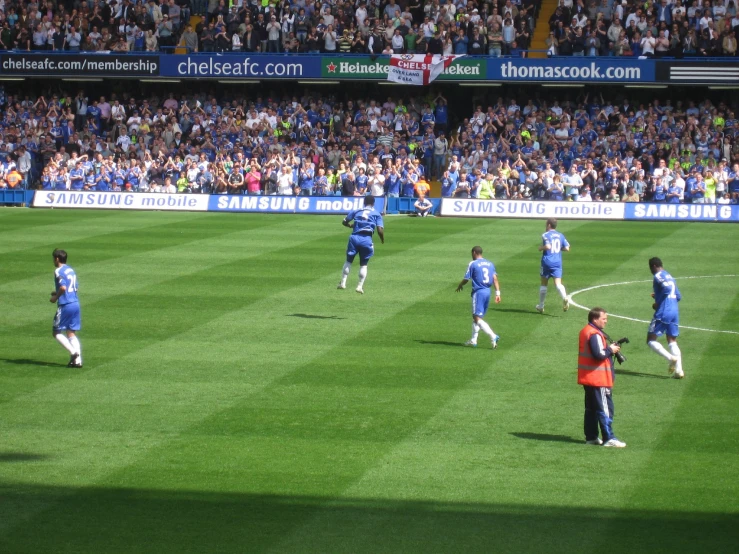 a soccer field with many players on it