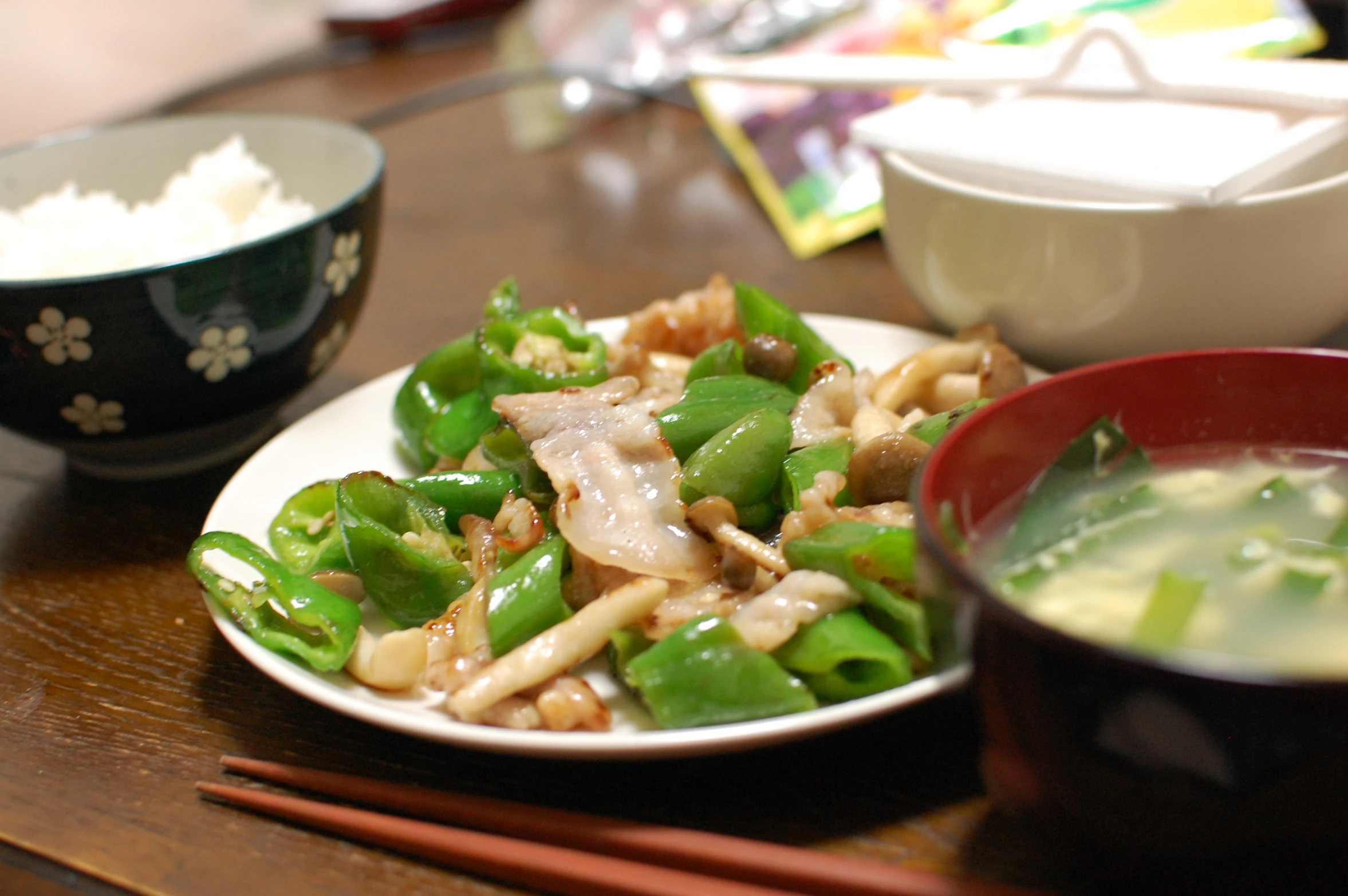 noodles and vegetables on a plate with chopsticks