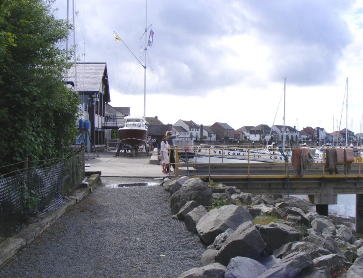 boats are parked on the pier at the dock