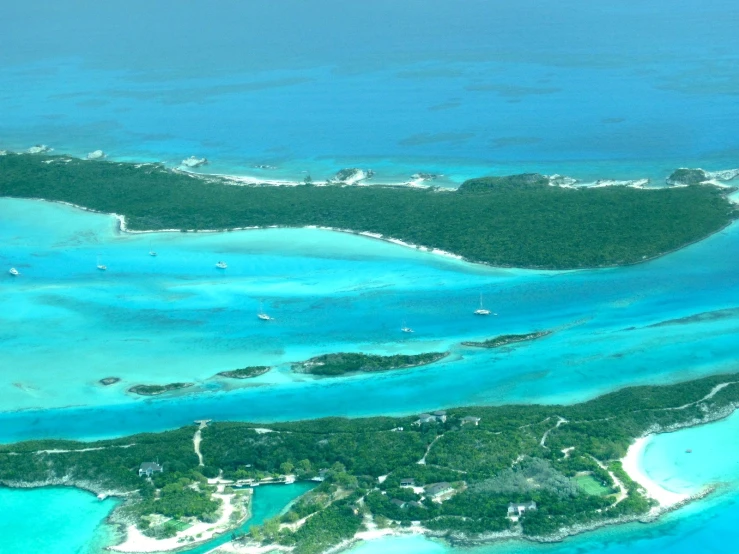 an aerial po of the beautiful turquoise waters surrounding the island