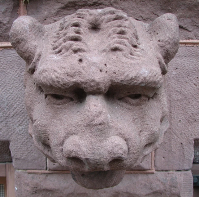 the cement statue looks like a wolf's head