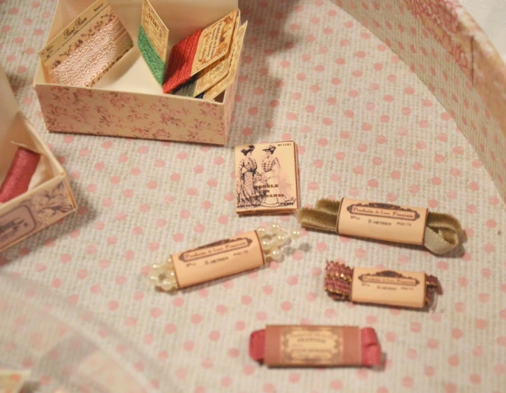 some miniature wooden pins in a box and other items