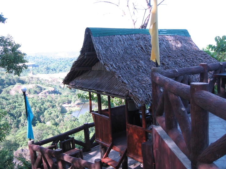 a thatch roof hut overlooking the treeline