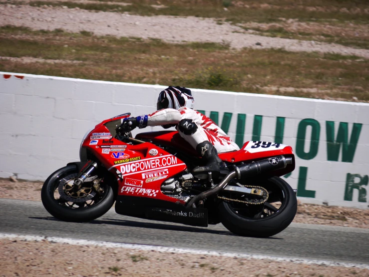 motorcycle racer leaning out of position to start race