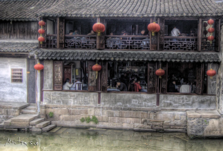 a painting of people outside a chinese style building