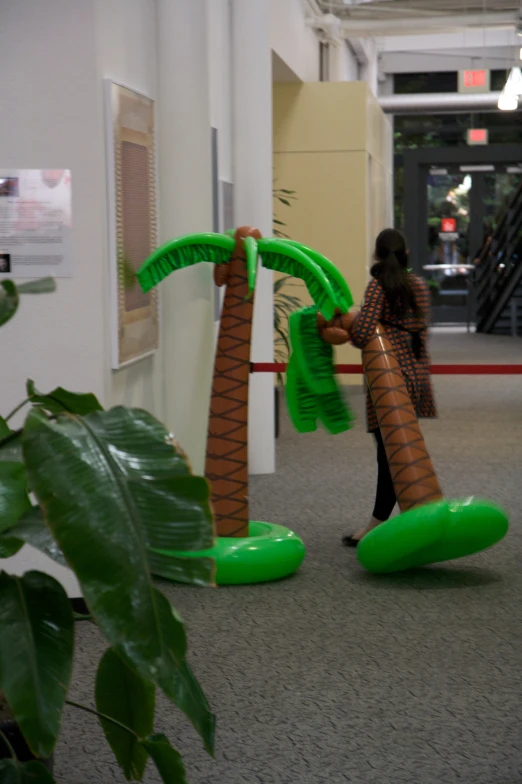 the palm trees are inflatable in this office hallway