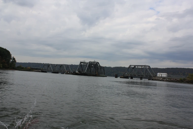 two train tracks crossing over a body of water