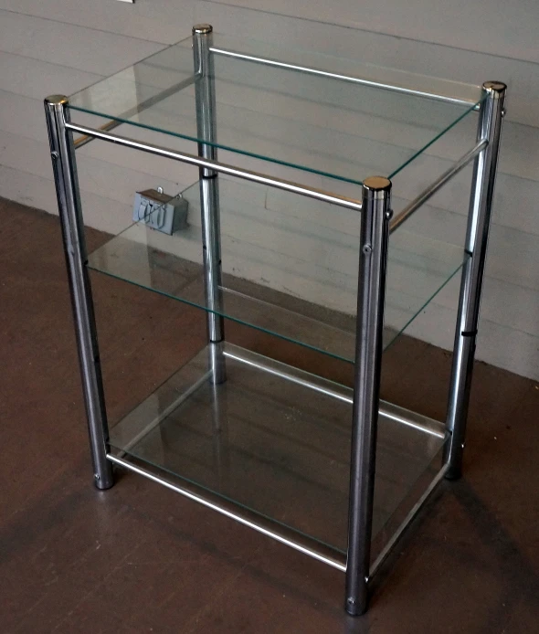 a glass display case on a brown floor