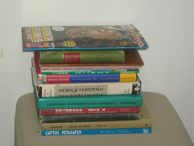 stack of books with magazine covers on them in corner