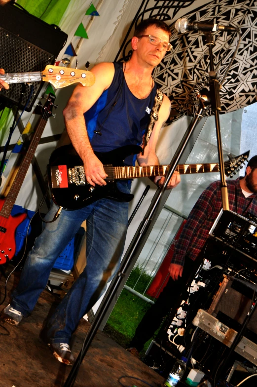 a man playing a guitar at an event