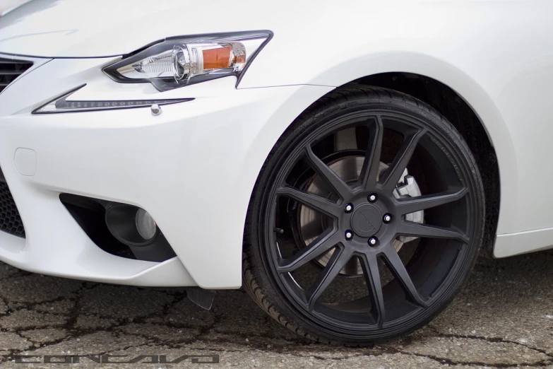 the rim of the white car is black with a silver rim