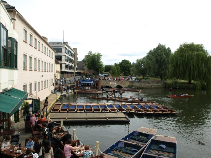 there are many boats moored next to each other in the water