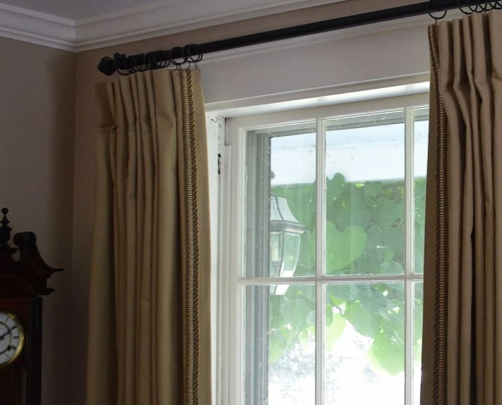 window with curtains hanging on both sides