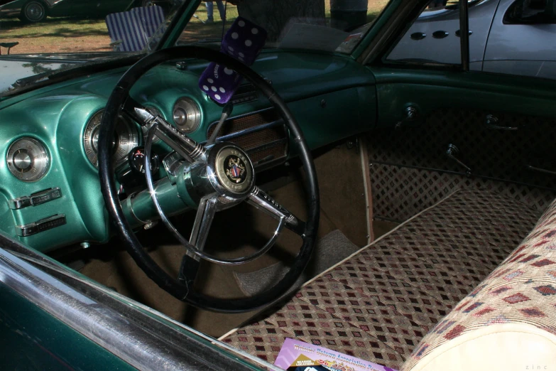 a car interior with a steering wheel in the middle