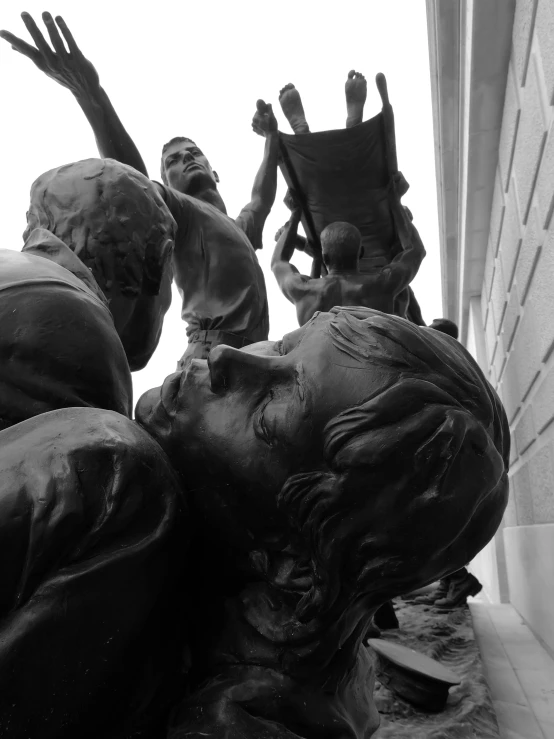 some children are gathered around an old statue