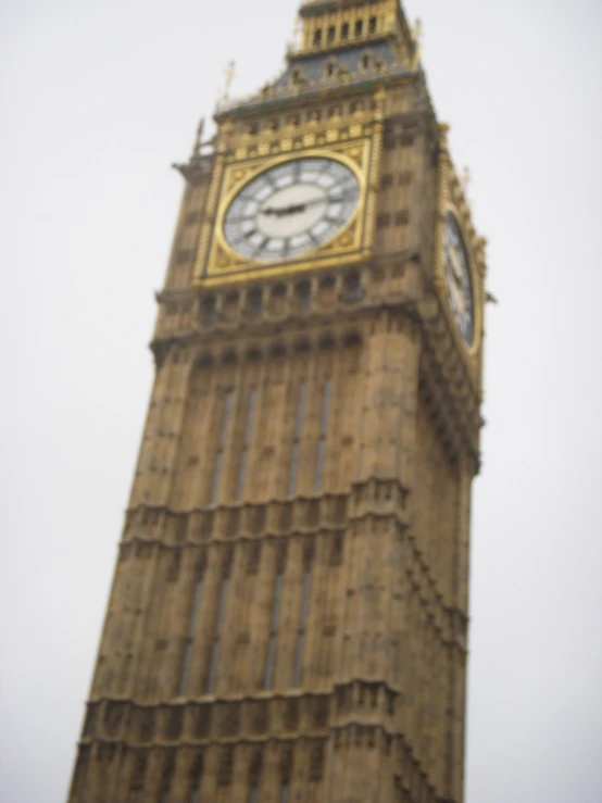 a very tall clock tower with a clock on each side