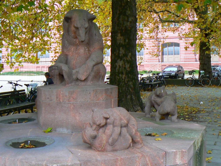 statues in a park setting, in the fall