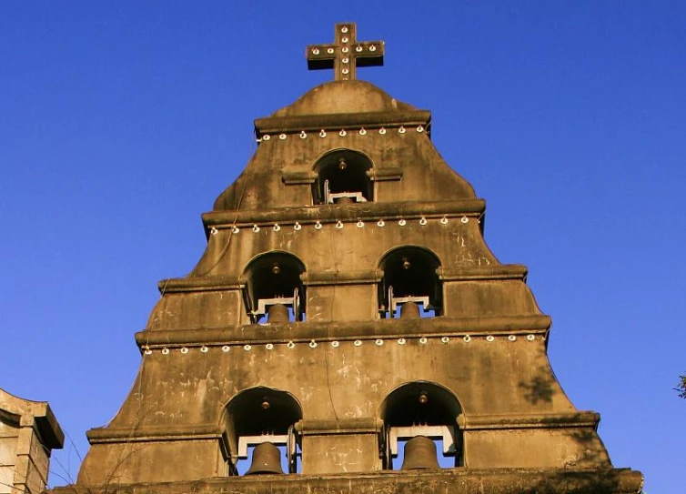 there is a large tower with bells at the top