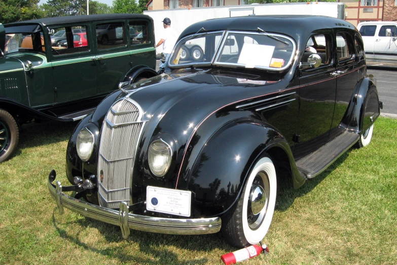 antique cars lined up and ready for the show